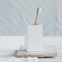 Image showing the Newcombe Toothbrush holder, H12 x W7 x L7cm, White product.