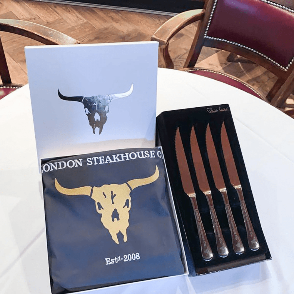 Set of Steak Knives with Apron and Three Course Dining Experience and Cocktail for Two at Marco Pierre White's London Steakhouse Co